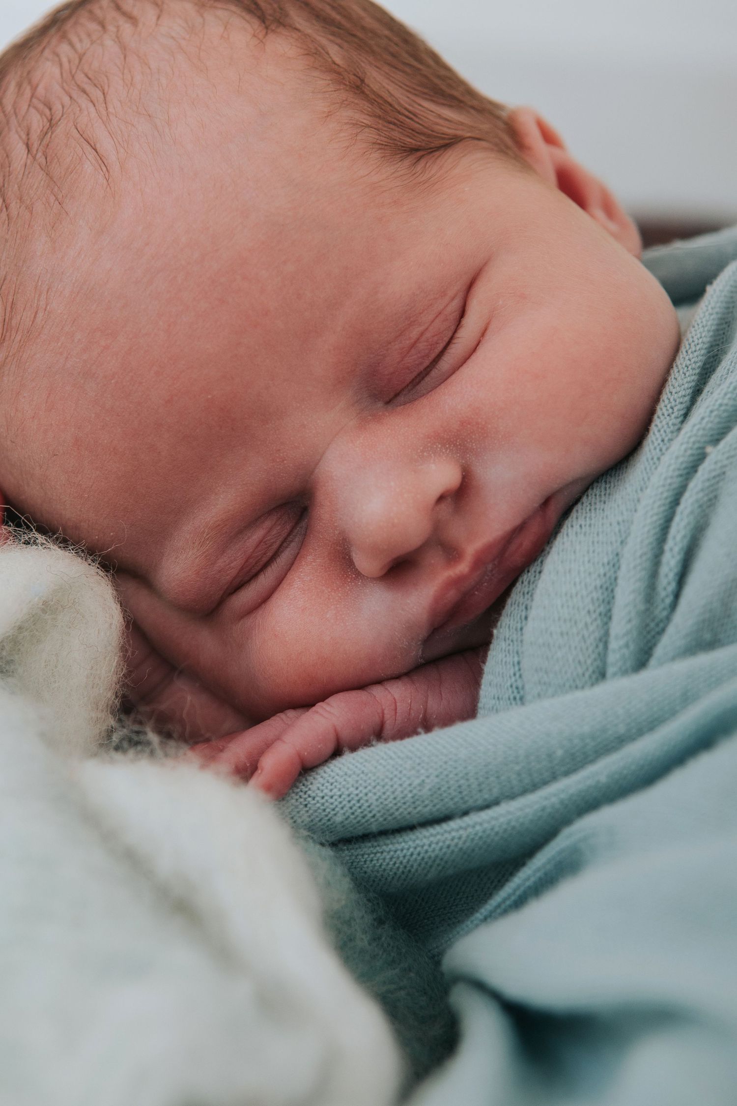 close up of newborn sleeping by devon based photographer Melanie Barnfield