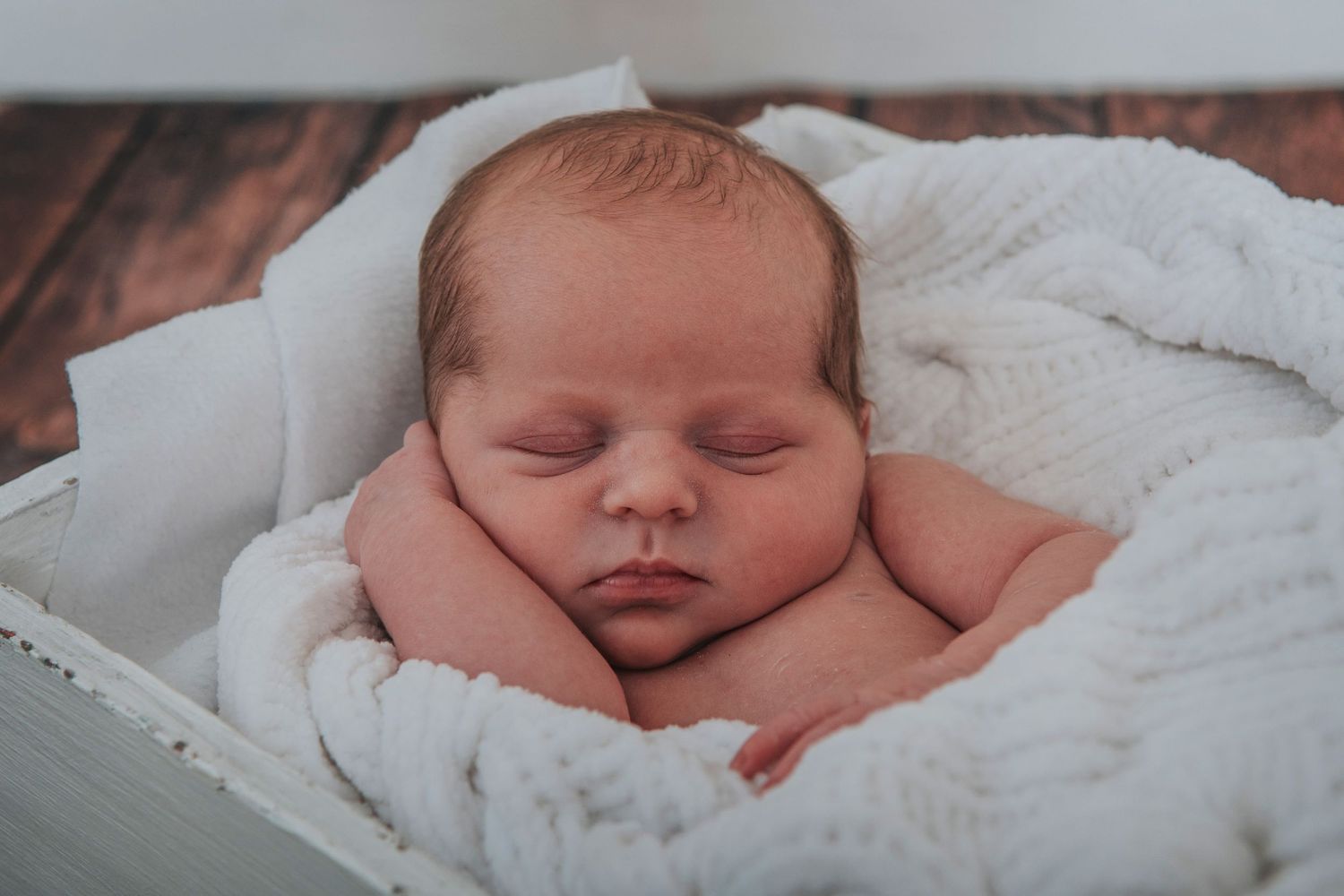 Sleeping newborn baby by devon based photographer Melanie Barnfield