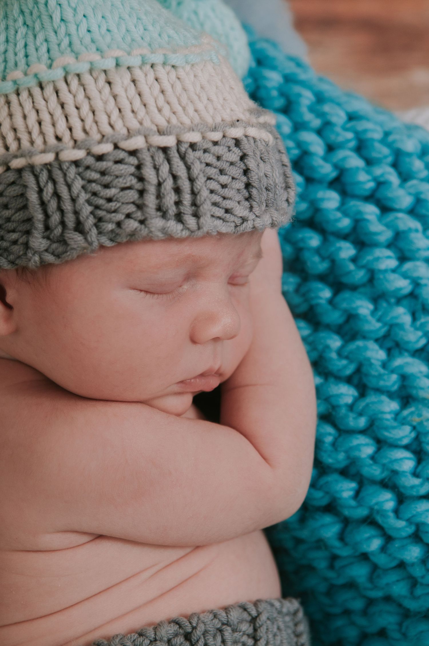 Close up of newborn baby sleeping by devon based photographer Melanie Barnfield