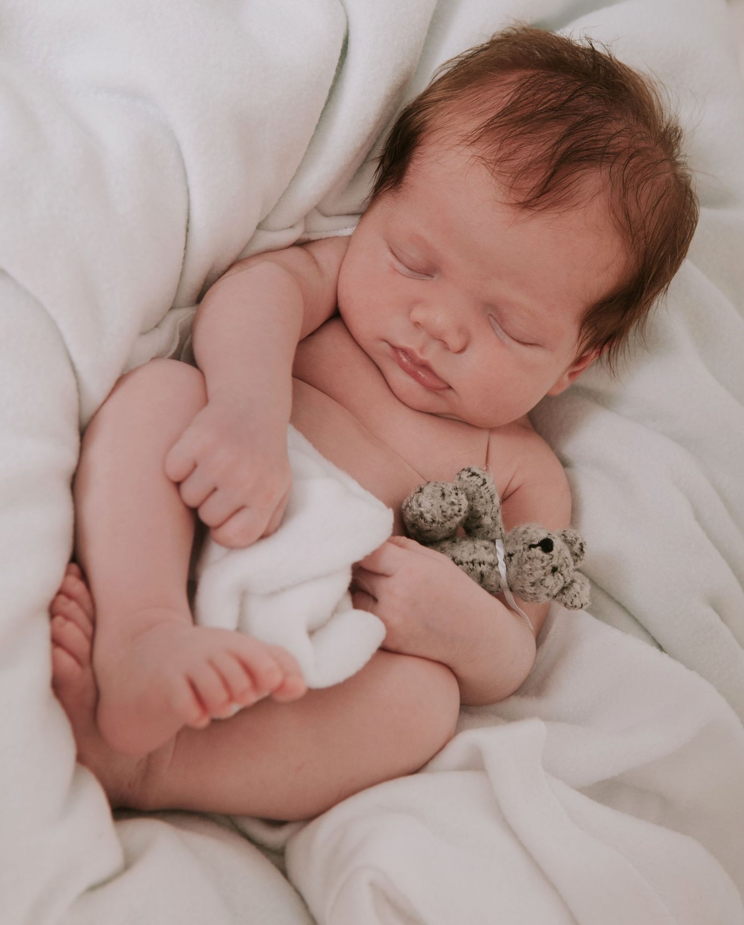Baby sleeping by devon based photographer Melanie Barnfield