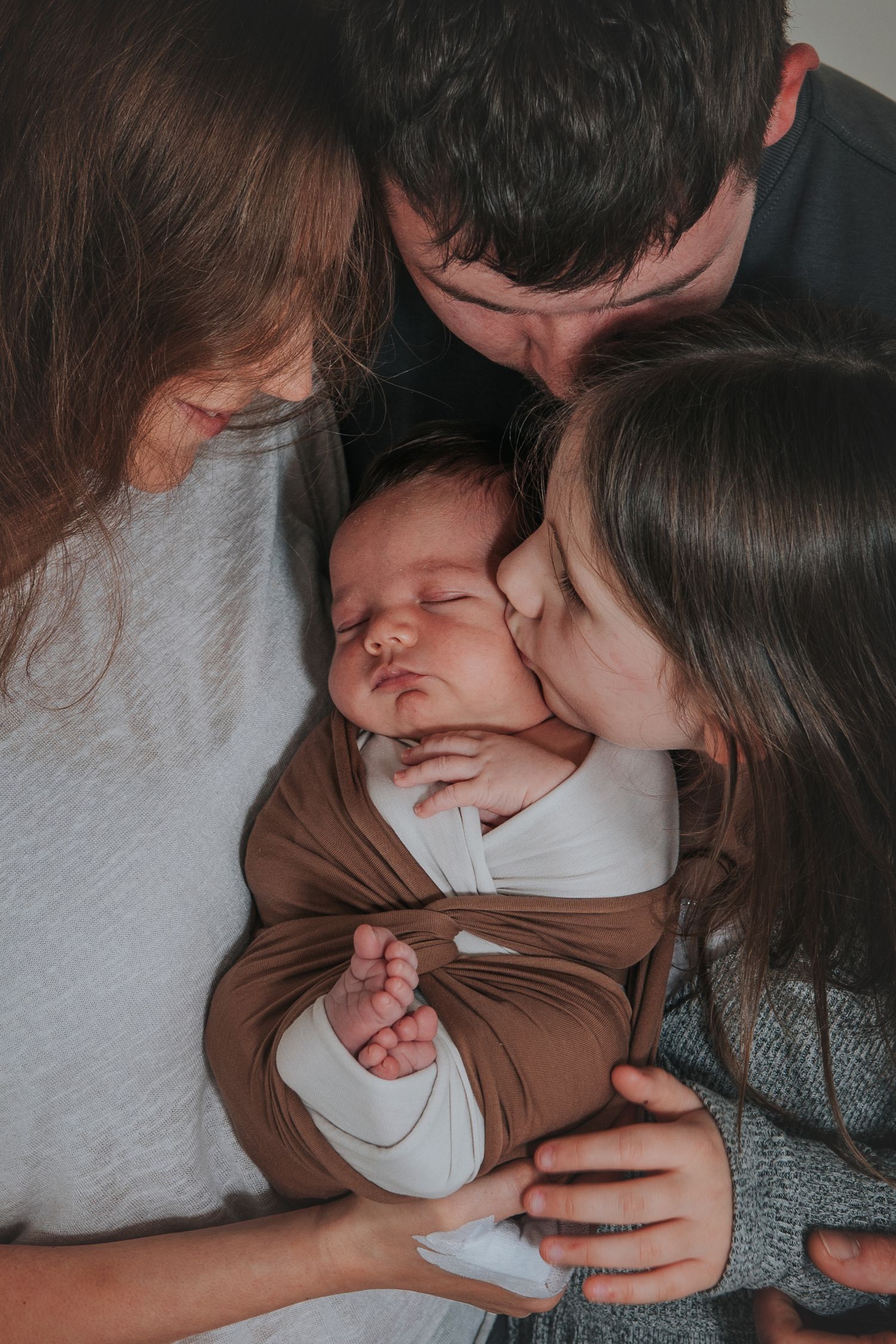 Newborn family close up portrait by devon based photographer Melanie Barnfield
