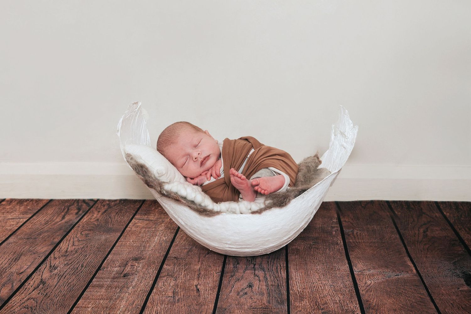 Newborn baby in bump cast by devon based photographer Melanie Barnfield