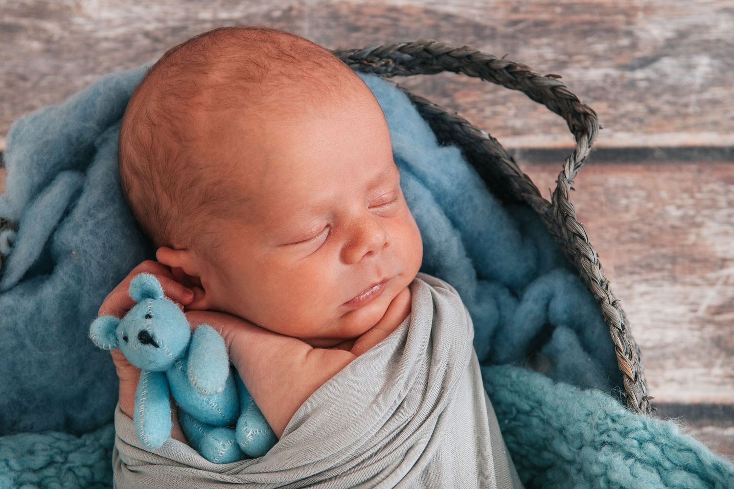 Beautiful blues with gorgeous newborn boy sleeping by devon based photographer Melanie Barnfield