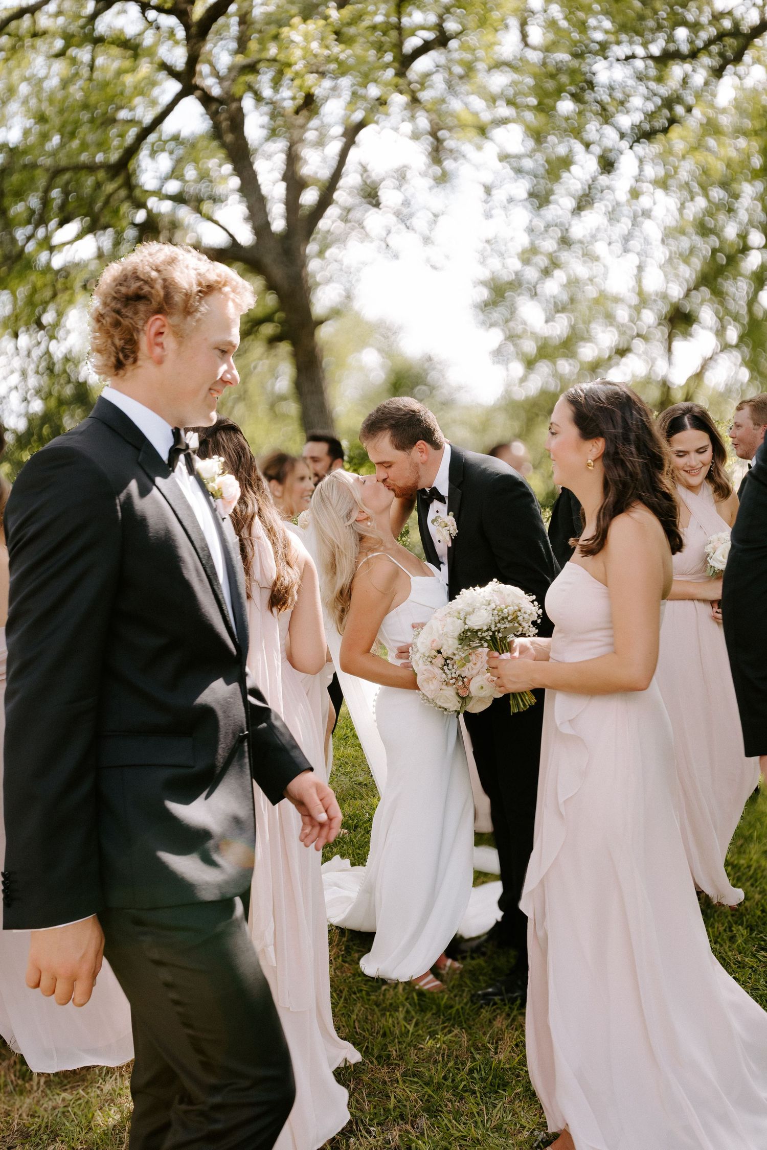 Candid wedding party photos with bridesmaids in light dresses and groomsmen in formal attire.