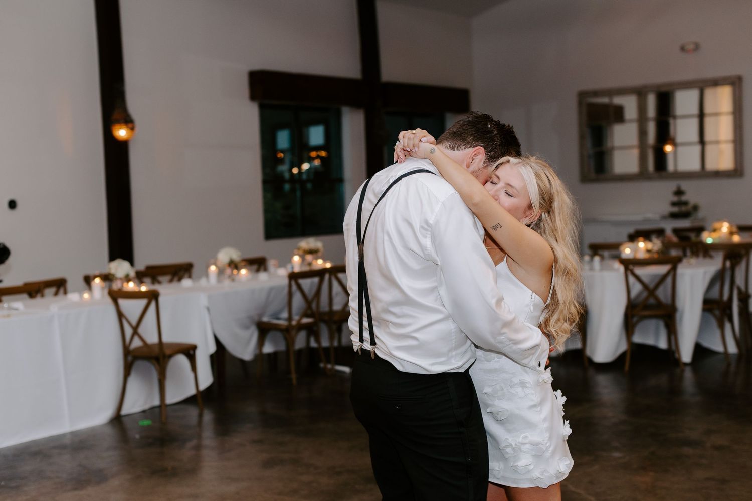 A collection of candid dancing photos showing romantic celebrations at an indoor wedding reception venue.