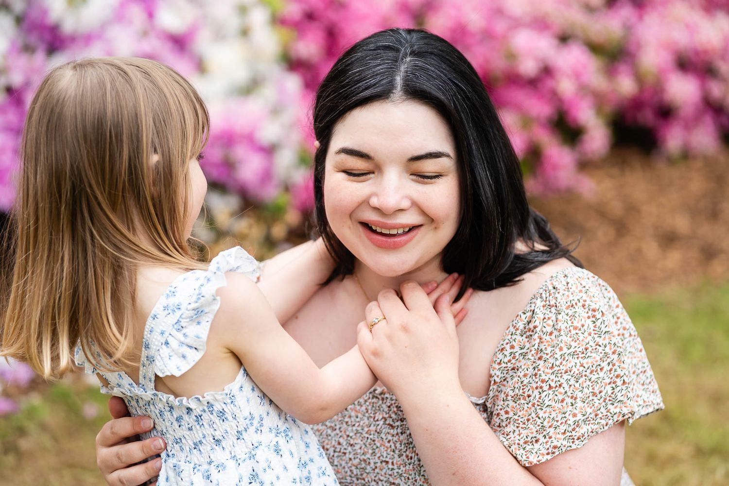 Daughter hugging mom in the spring in Seattle.