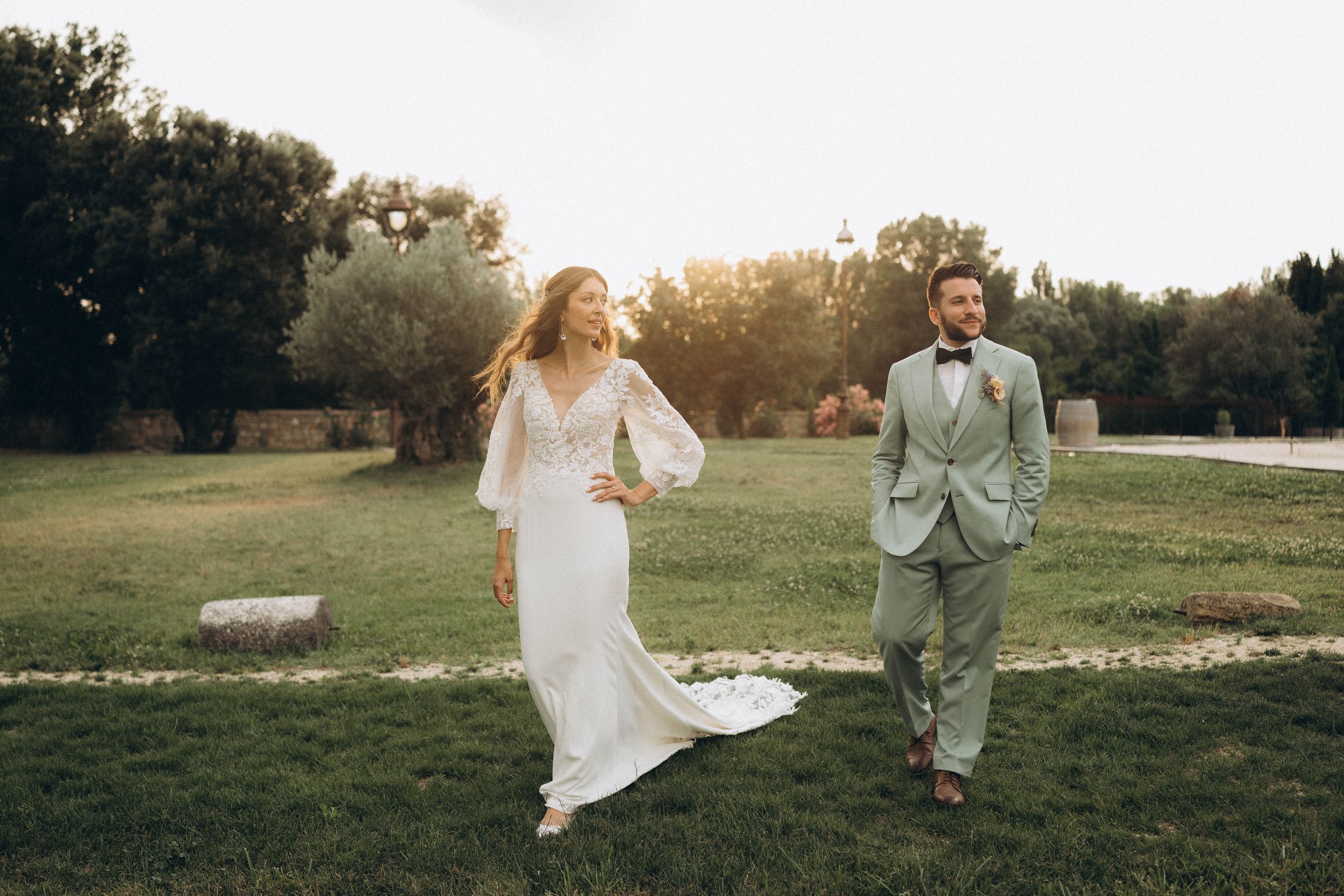 A romantic dance silhouette under stone archways with warm lighting.
