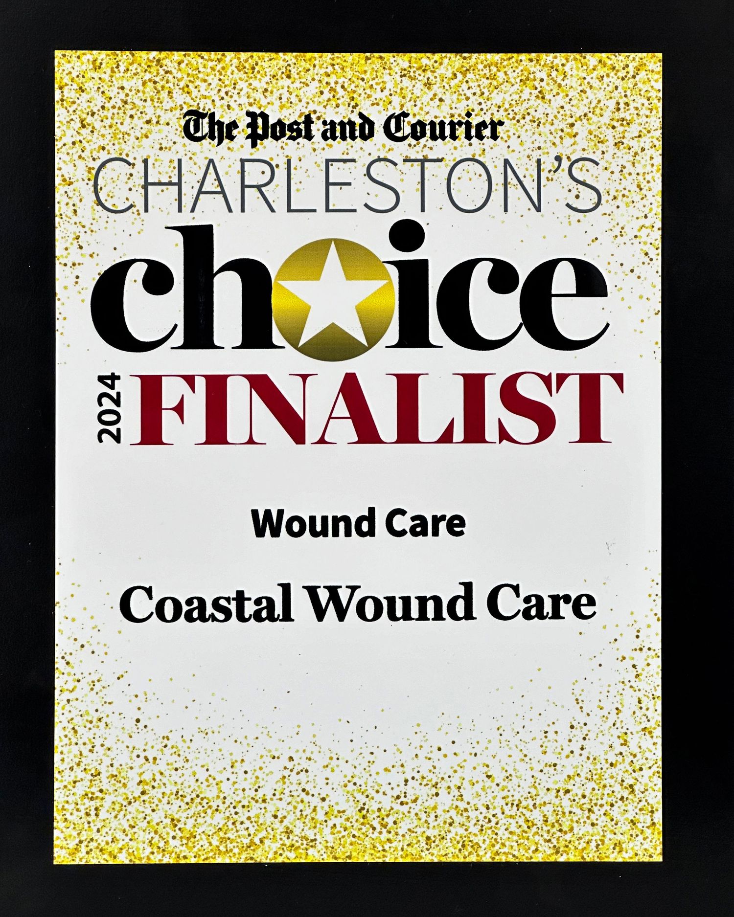 Medical staff in navy blue scrubs stand in front of a Coastal WoundCare facility with a Vote Now button and QR code below.