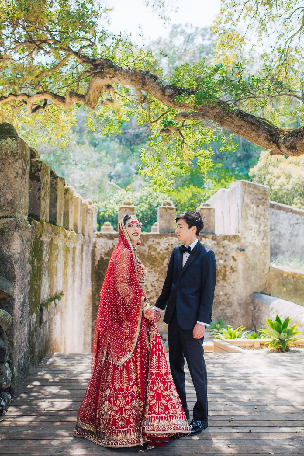 Bride & groom sharing a romantic moment, photographed by an Indian destination wedding photographer in Portugal - Penha Longa