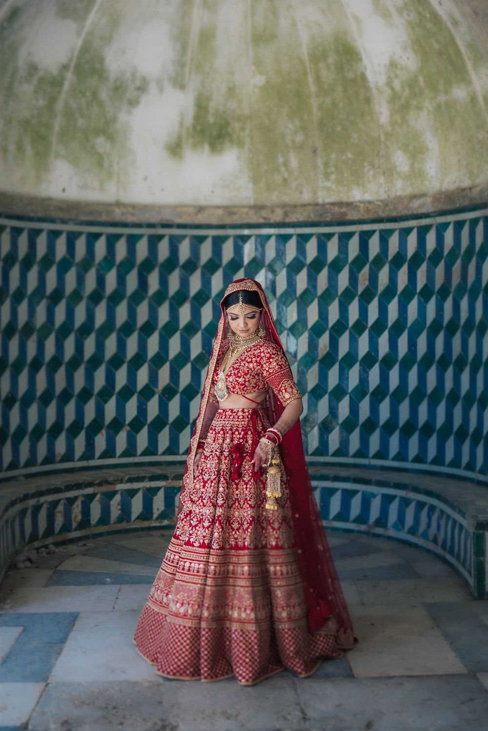 bride portrait in traditional South Asian wedding attire lehenga from sabyasachi in Penha longa resort portugal wedding photographer