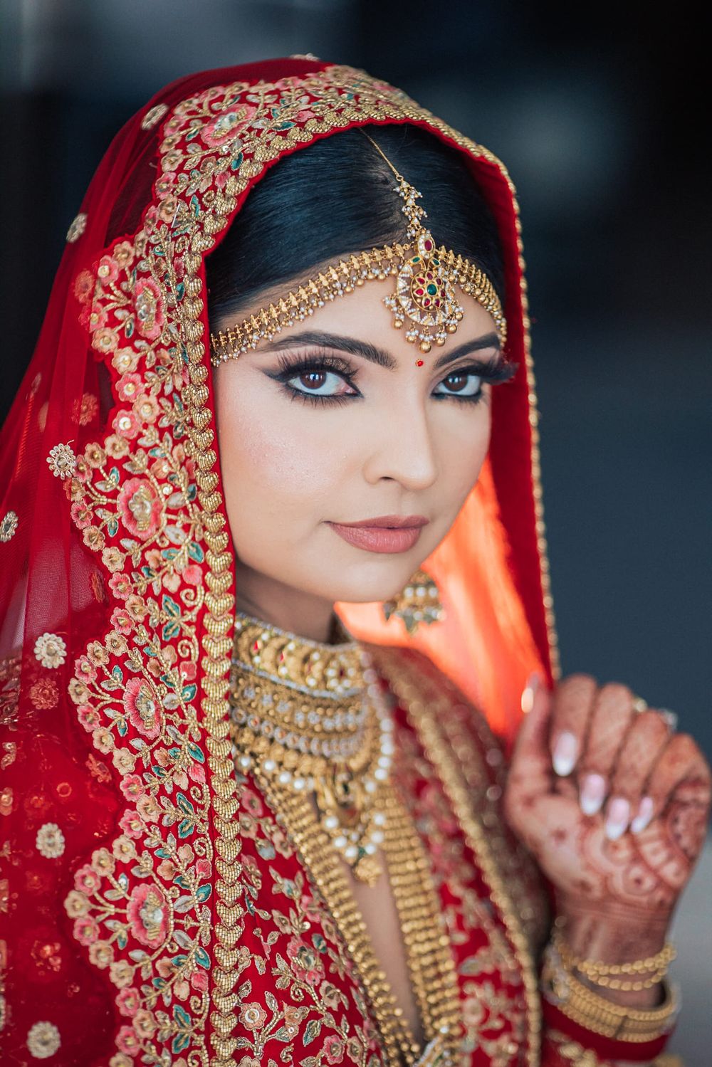 bride portrait in traditional South Asian wedding attire lehenga from sabyasachi in Penha longa resort. by portugal wedding photographer