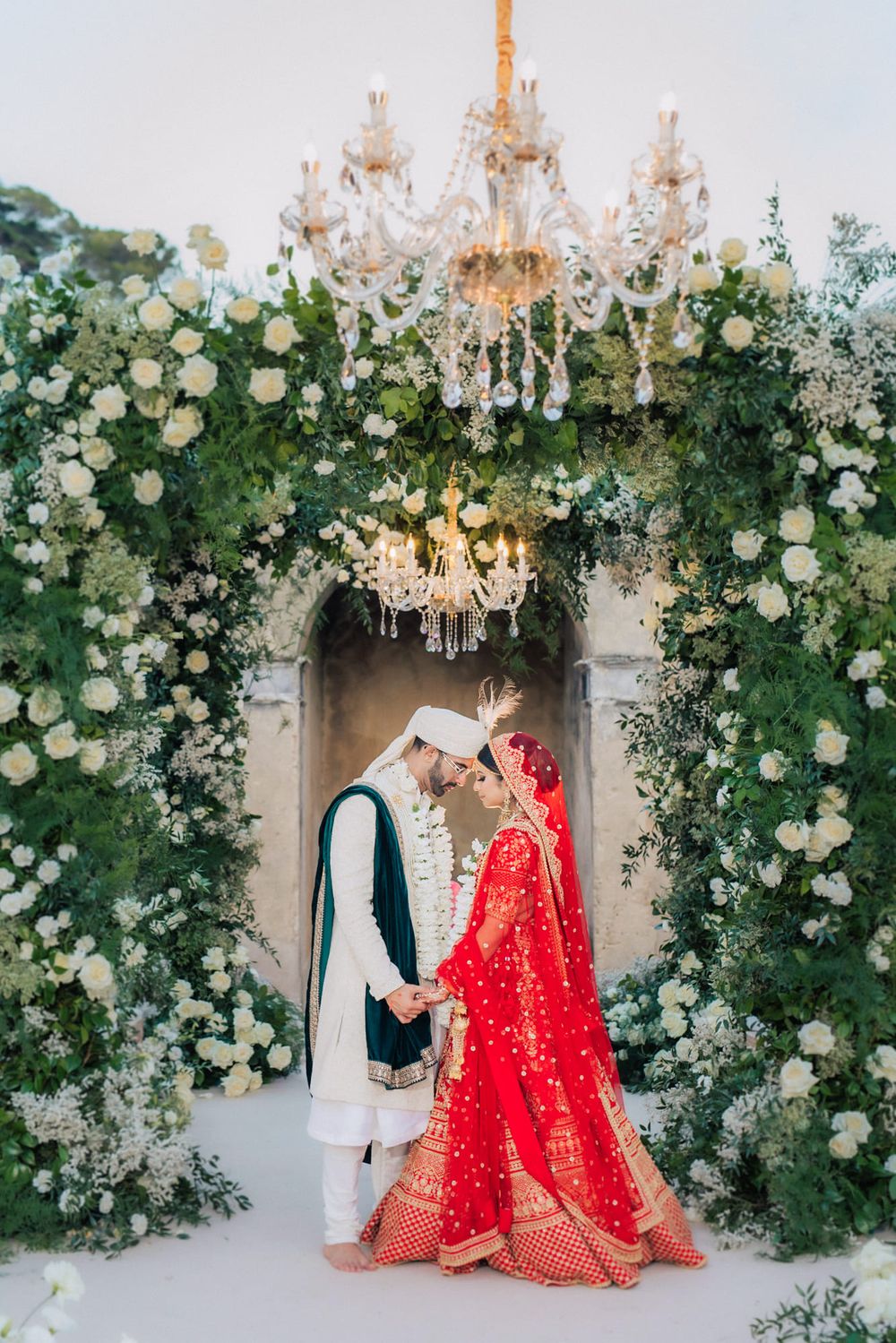 bride portrait in traditional South Asian wedding attire lehenga from sabyasachi in Penha longa resort. by portugal wedding photographer