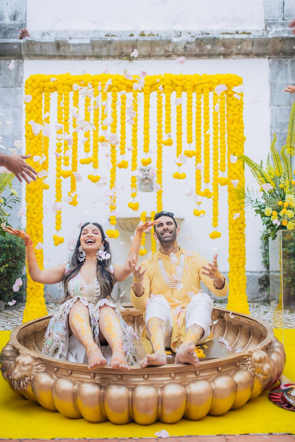 Vibrant Pithi / Haldi ceremony with family blessings, documented by an Indian destination wedding photographer in Portugal - Penha Longa