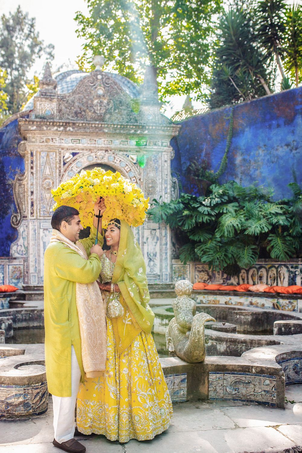 Bride & groom sharing a joyful moment, photographed by an Indian destination wedding photographer in Portugal – Fronteira Palace