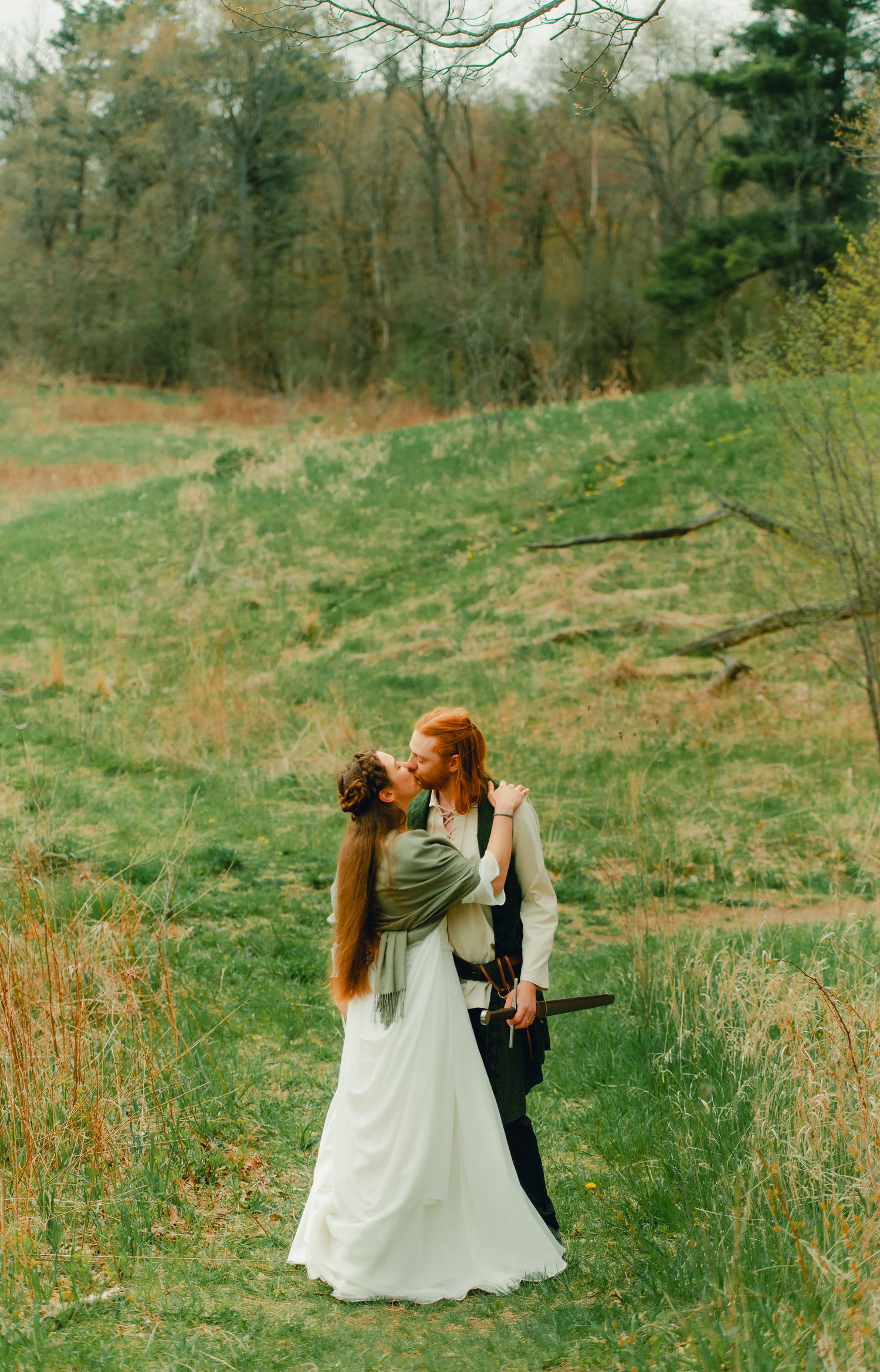 Couple walking into spring forest together.