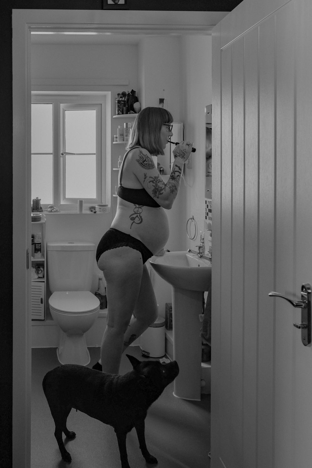 Candid, unposed maternity photography with pets – because dogs are family too. monochrome, natural light