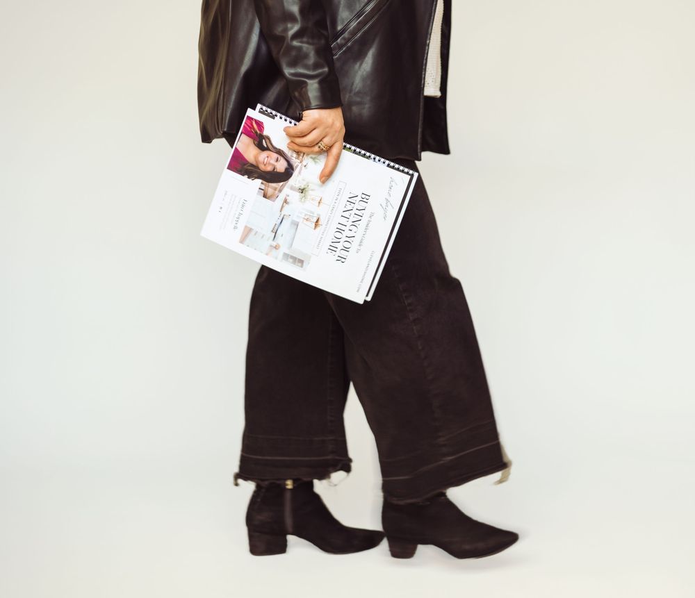 Black boots and lower body shot against white background.