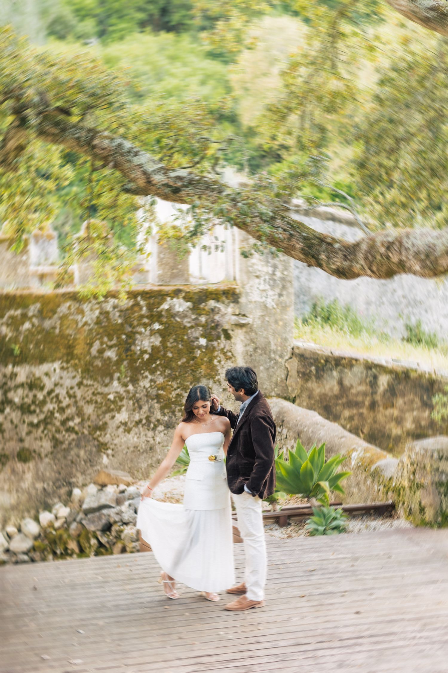 Romantic engagement photo-shoot in Sintra, Portugal, with an Indian couple exploring Penha Longa. By a destination wedding Photographer