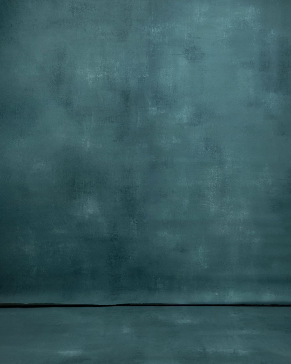 A textured teal blue backdrop with a dark horizontal line near the bottom creating a moody atmospheric effect.