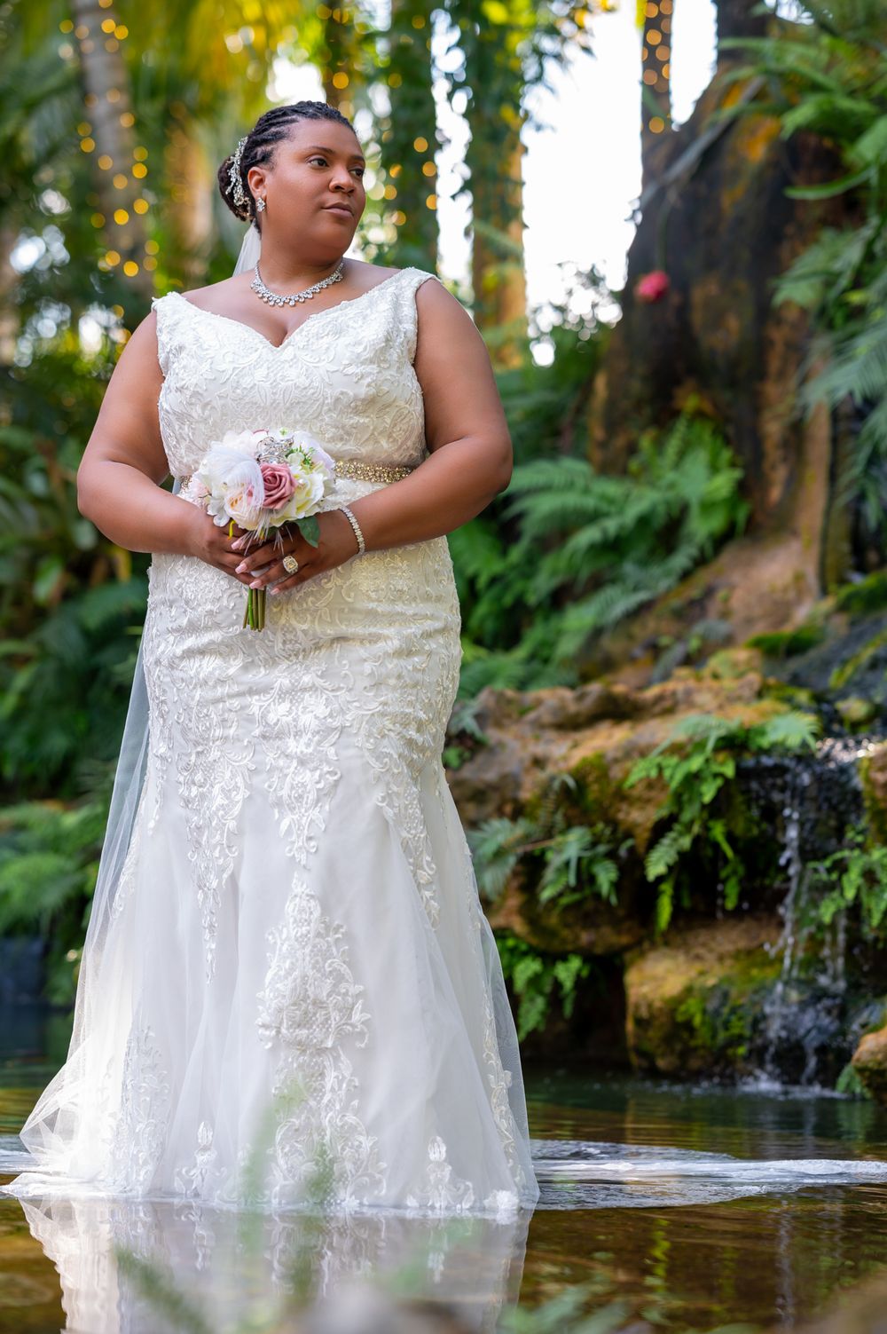Candid laughter between bride and groom in Secret Gardens, documented by wedding photographers in South Florida.