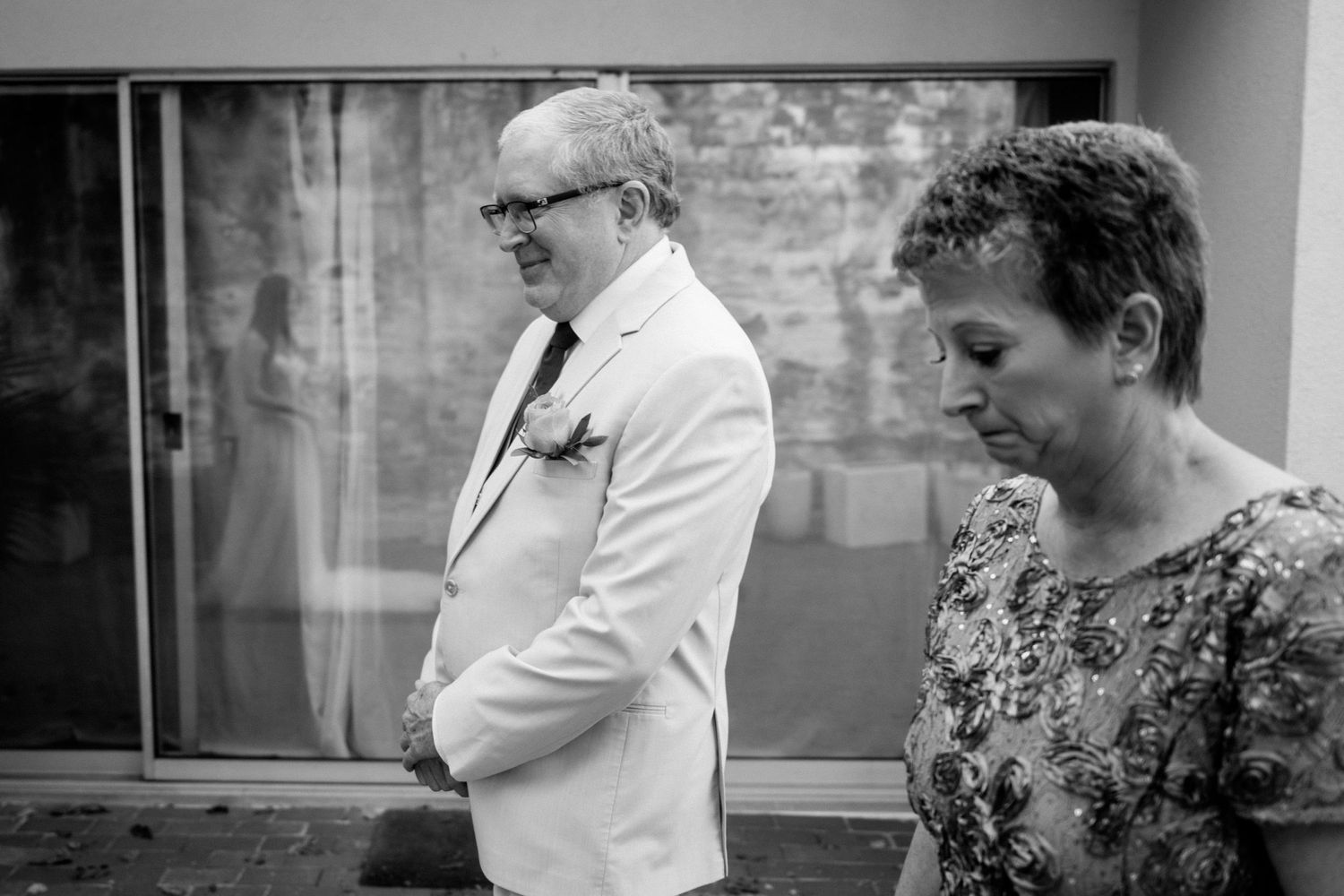 Black and white candid moment captured during the wedding celebration.