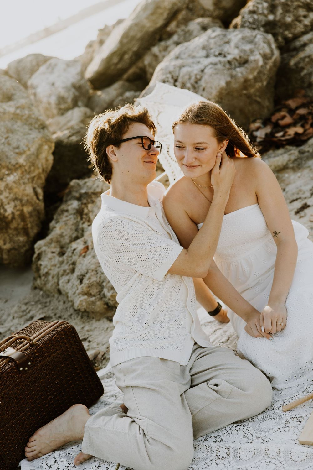 Golden Hour engagement photos of a couple having a beach picnic at Dubois Park in Jupiter, Florida captured by Lindsay McDow Photography