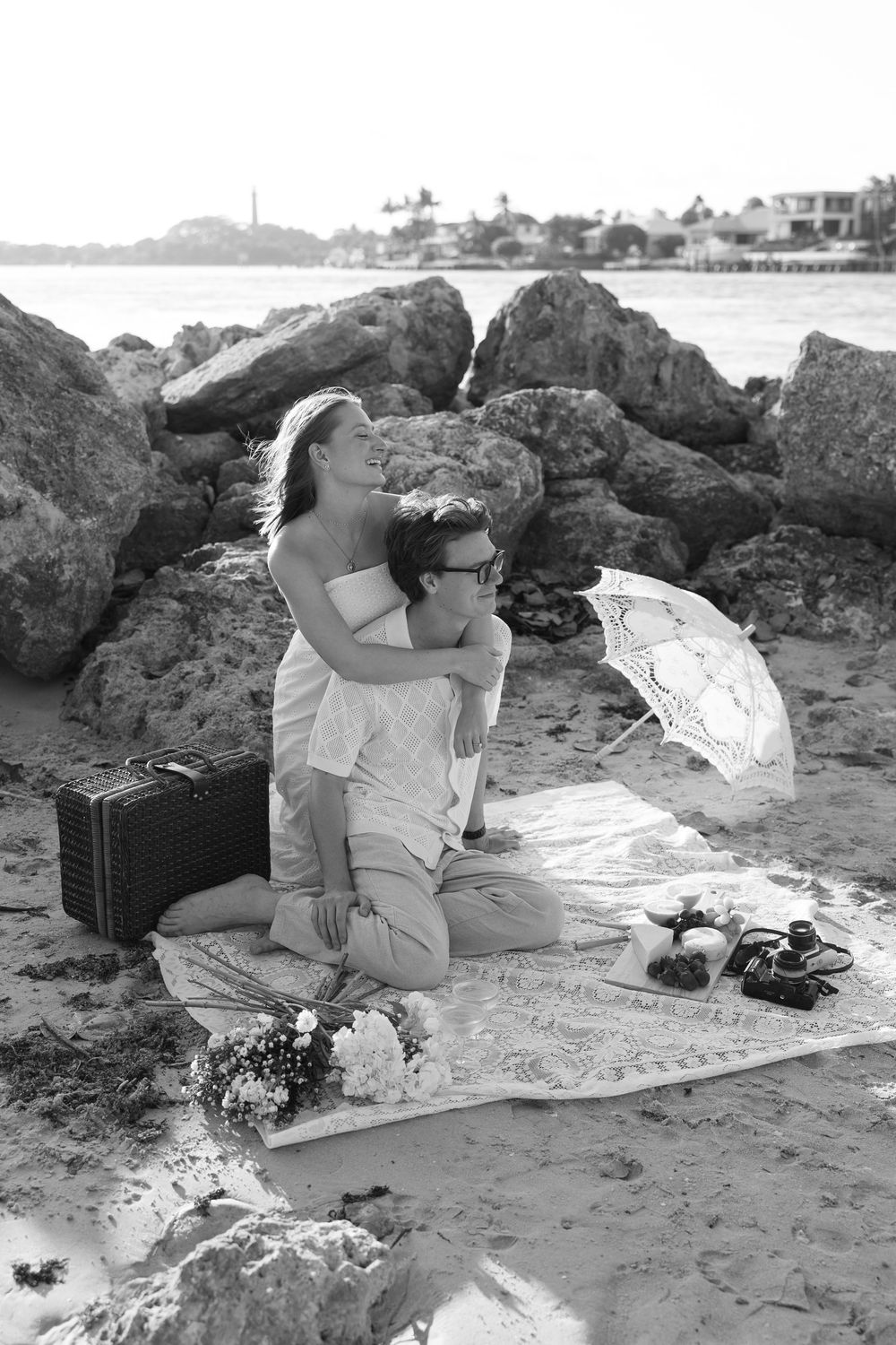 Golden Hour engagement photos of a couple having a beach picnic at Dubois Park in Jupiter, Florida captured by Lindsay McDow Photography