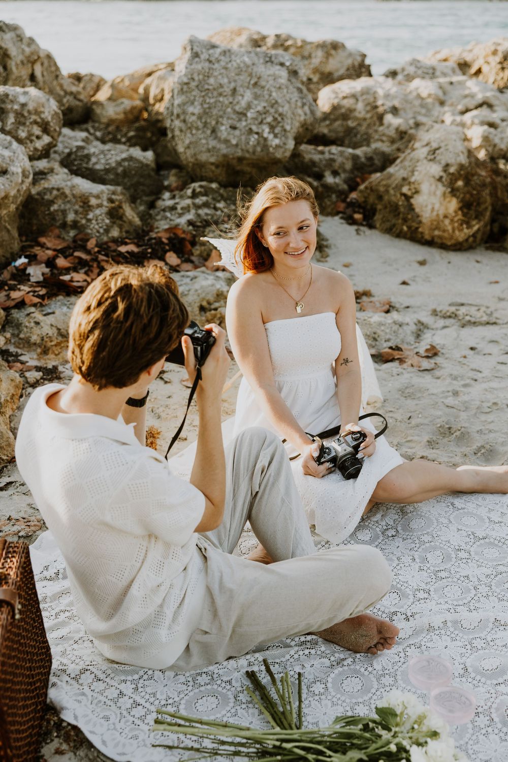 Golden Hour engagement photos of a couple having a beach picnic at Dubois Park in Jupiter, Florida captured by Lindsay McDow Photography