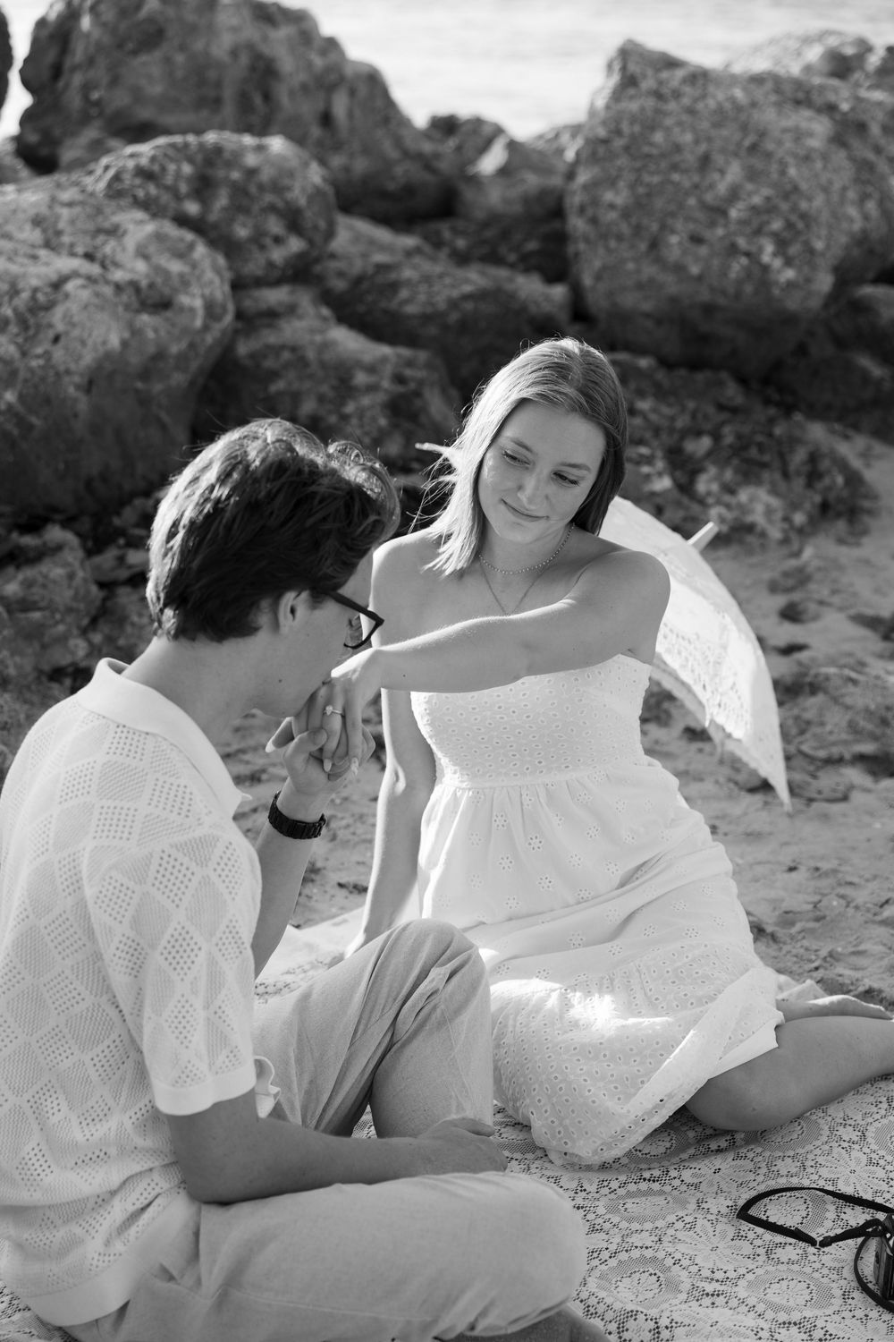 Golden Hour engagement photos of a couple having a beach picnic at Dubois Park in Jupiter, Florida captured by Lindsay McDow Photography