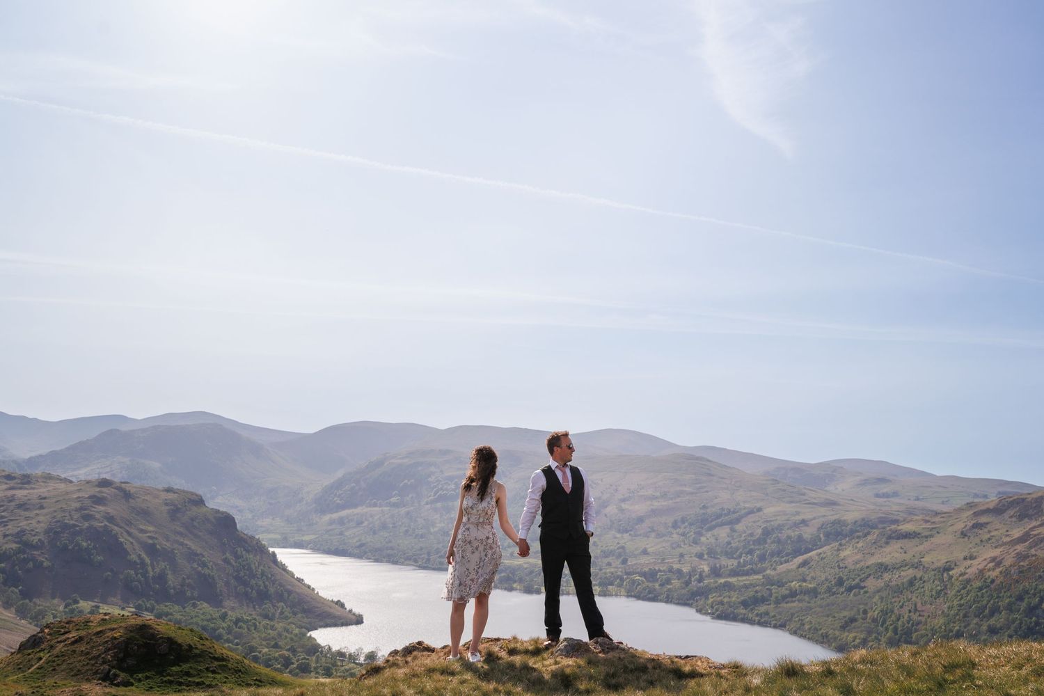 A series of panoramic landscape photos showing scenic mountain views and coastal vistas in the hazy afternoon light.
