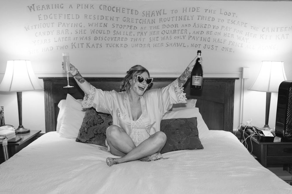 Black and white panoramic view of a bedroom interior with artistic text overlay at the top.
