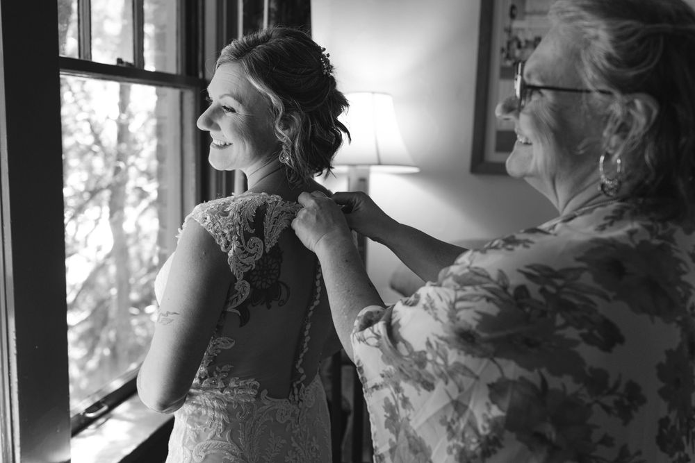 Wedding preparations captured in elegant black and white photography.