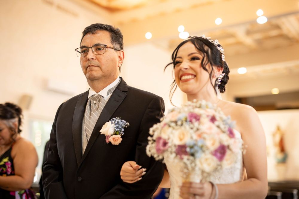 Traditional church wedding procession with elegant floral bouquet.