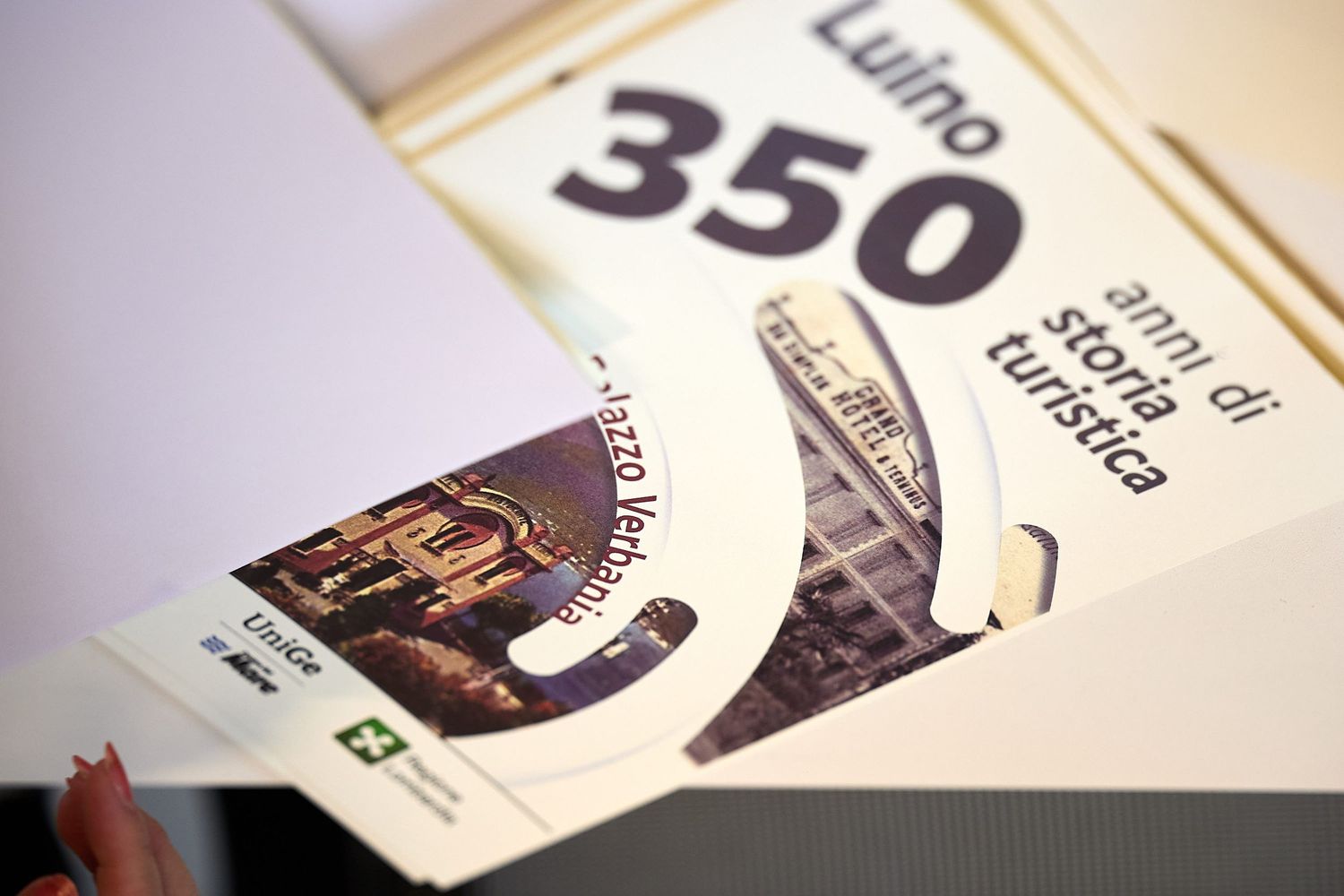 A concert or event ticket with the number 350 visible.