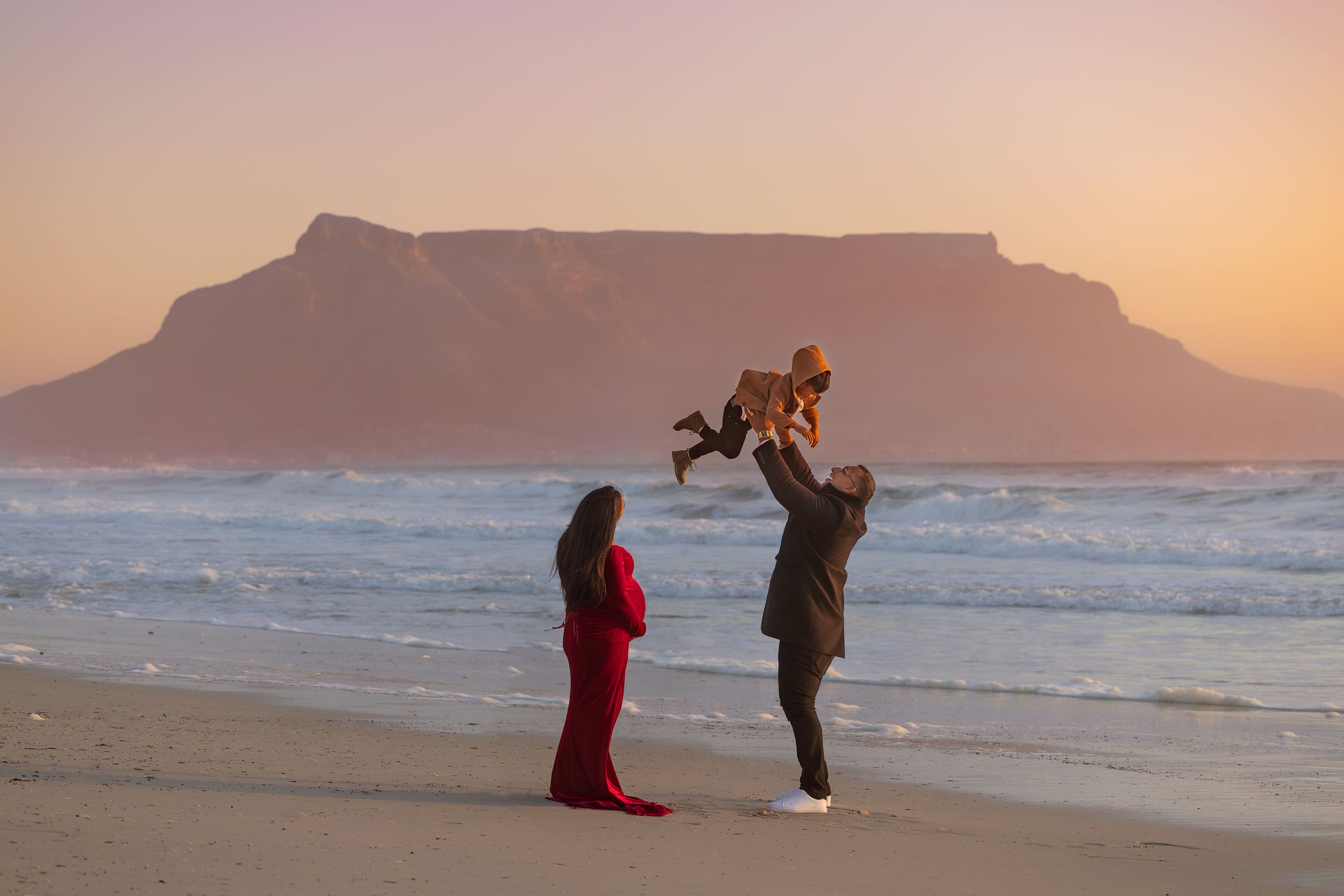 Beautiful sunset maternity photoshoot Cape Town of family on Blouberg beach By Grace Photography Birth photographer