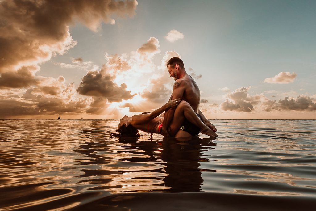 couple on the beach with a beautiful sunset