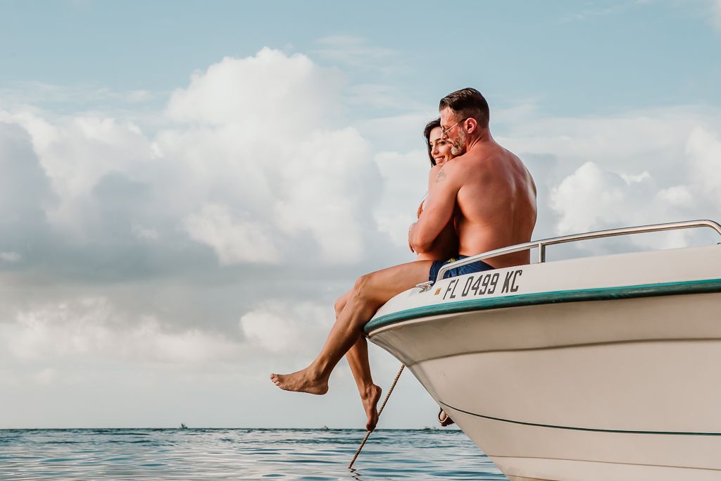 couple kissing on a yacht