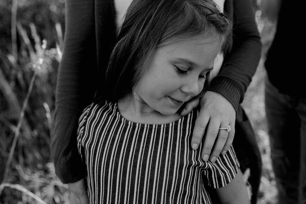 Blog Engagement Family Kansas City Photography Daughter in front of mom looking over at engagement ring