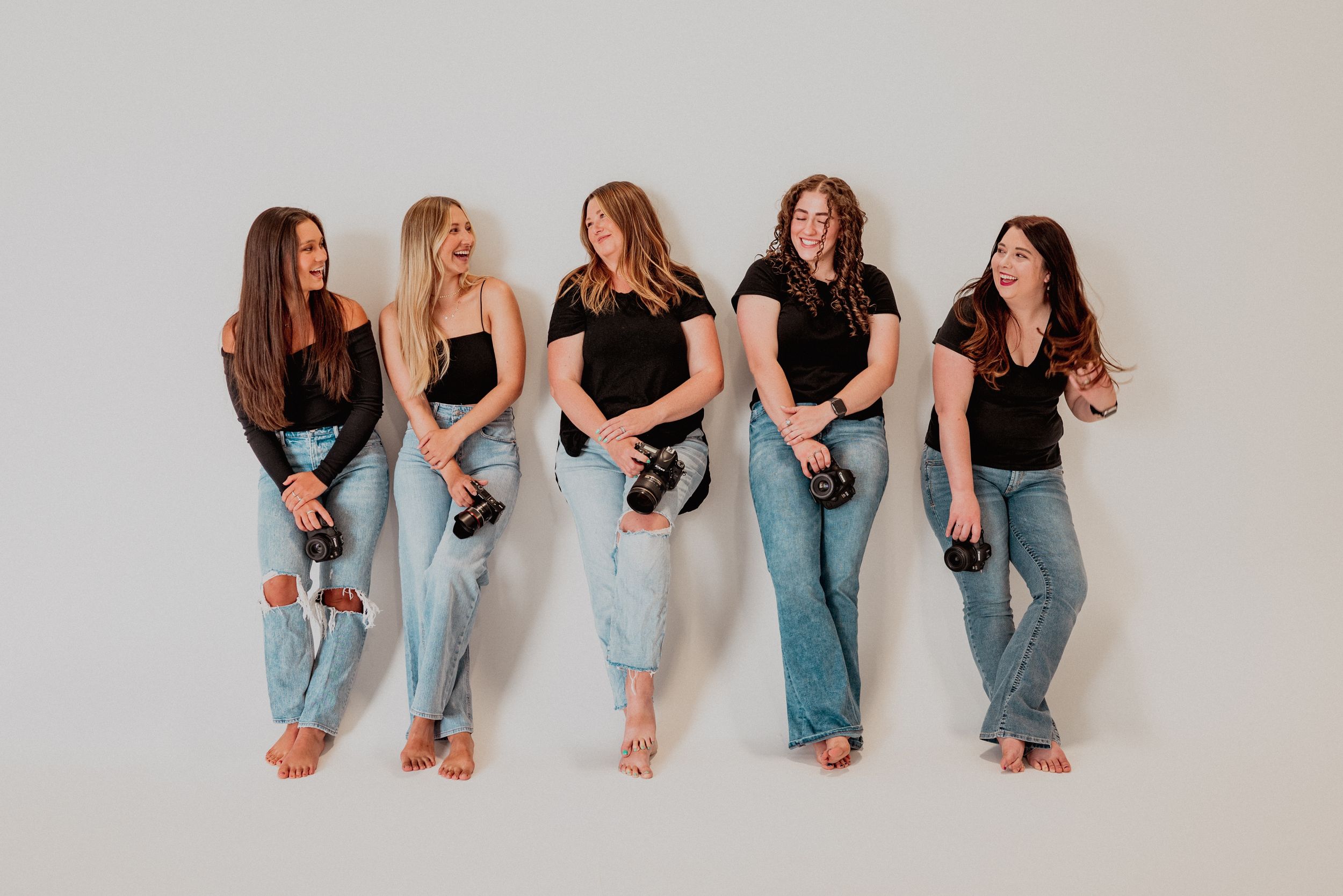 Creative women in business smiling at each other