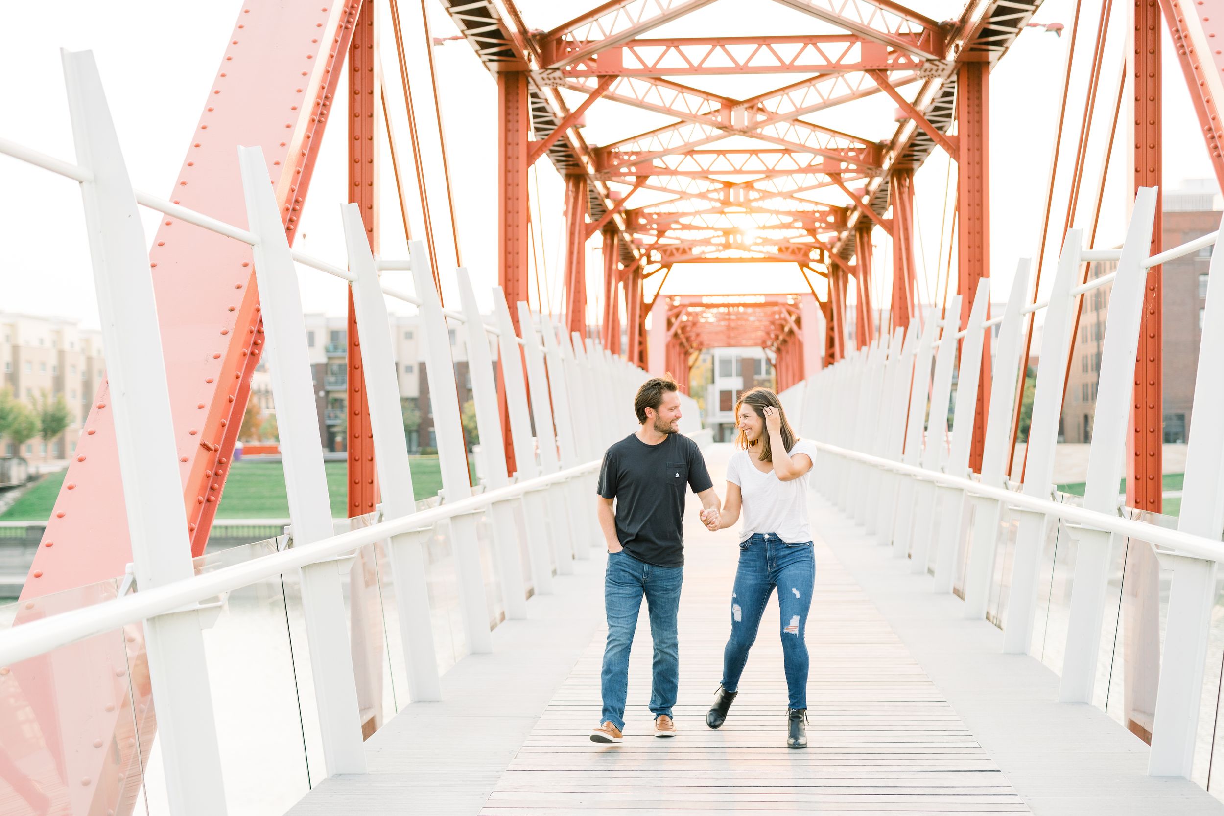 Des Moines Engagement photos in downtown Des Moines, Iowa with light and airy photographer Nicole Laing