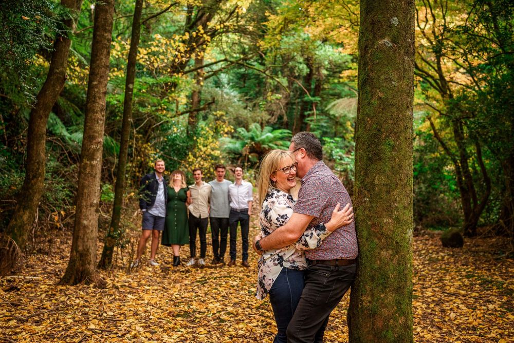 Couple with adult children during Autumn in Melbourne's Dandenongs