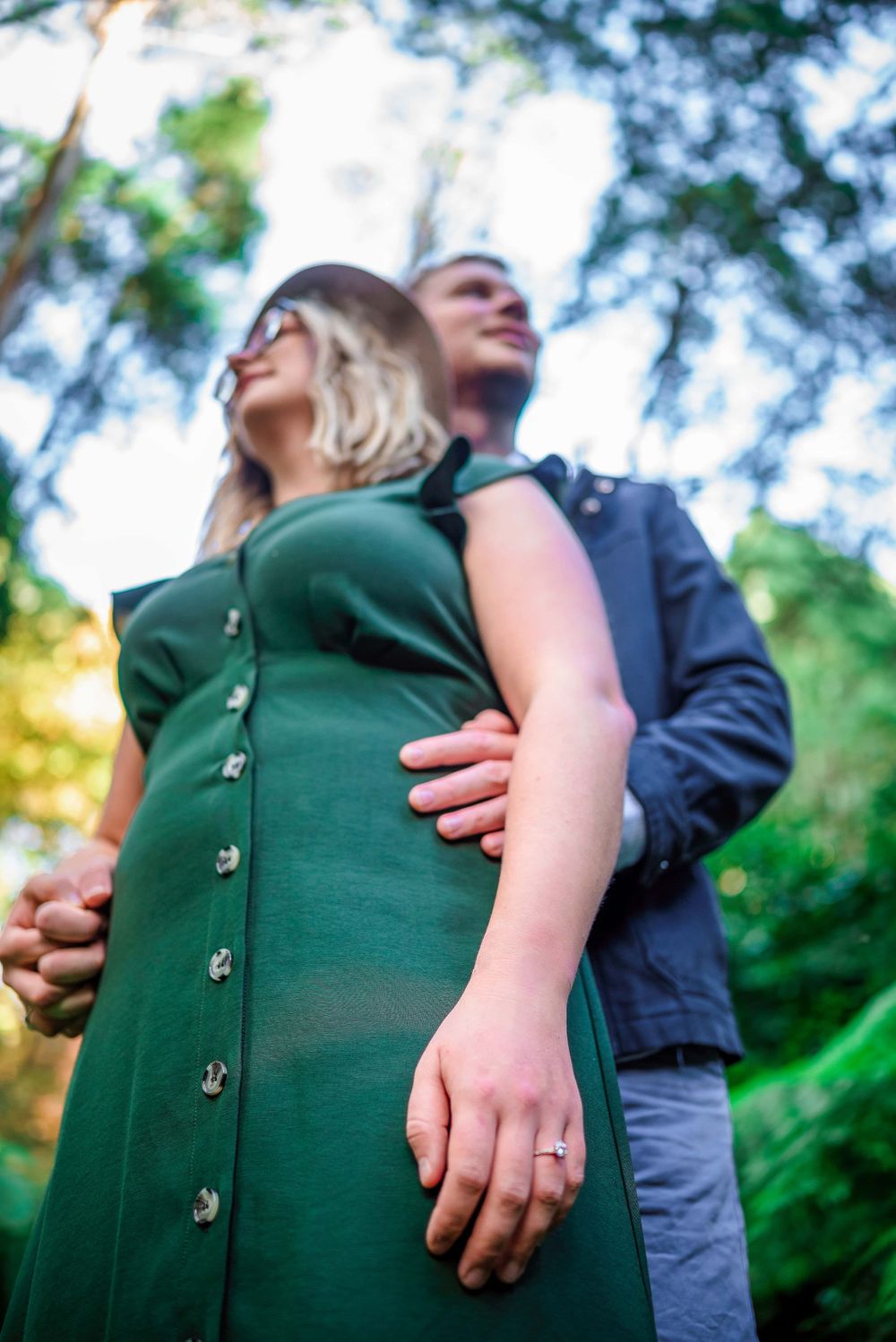 Engaged couple in forest in Dandenongs showing off engagement ring