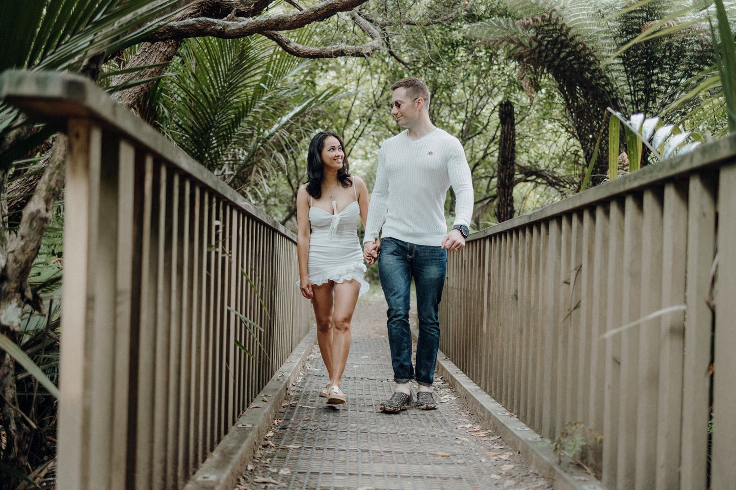 A couple headed to Karekare Beach in their post-wedding photoshoot with Apertured Media-Auckland Wedding Photographer.