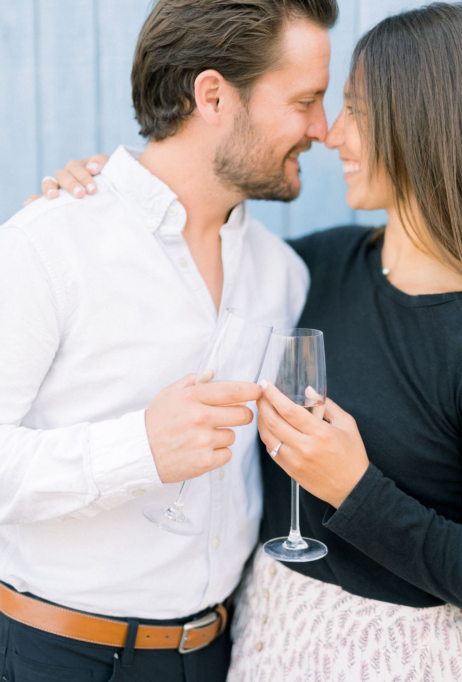 Des Moines Engagement photos in downtown Des Moines, Iowa with light and airy photographer Nicole Laing