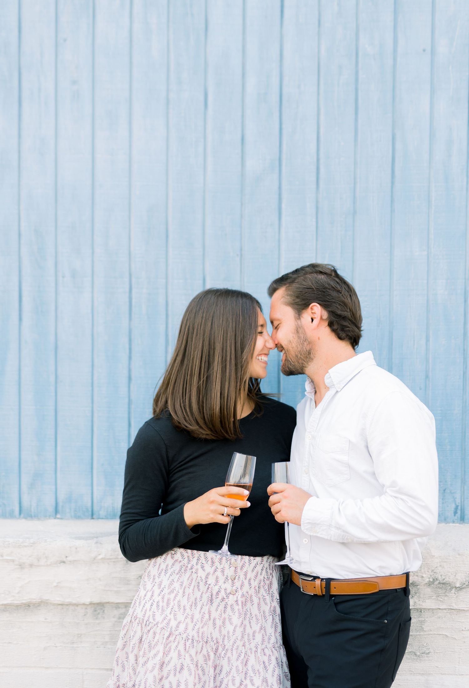 Des Moines Engagement photos in downtown Des Moines, Iowa with light and airy photographer Nicole Laing