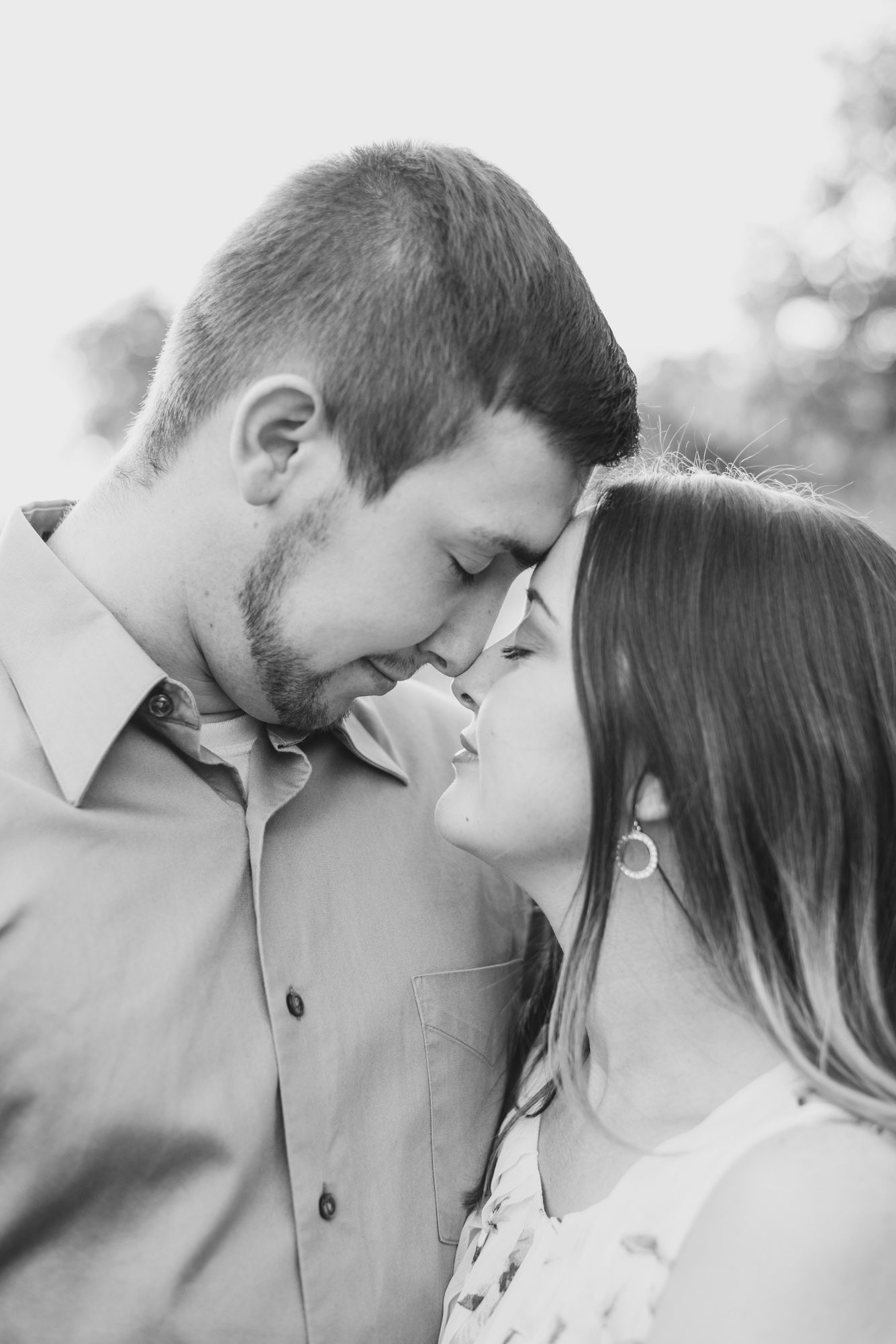 Couple touching forehead in black and white at Moraine State Park in Pennsylvania