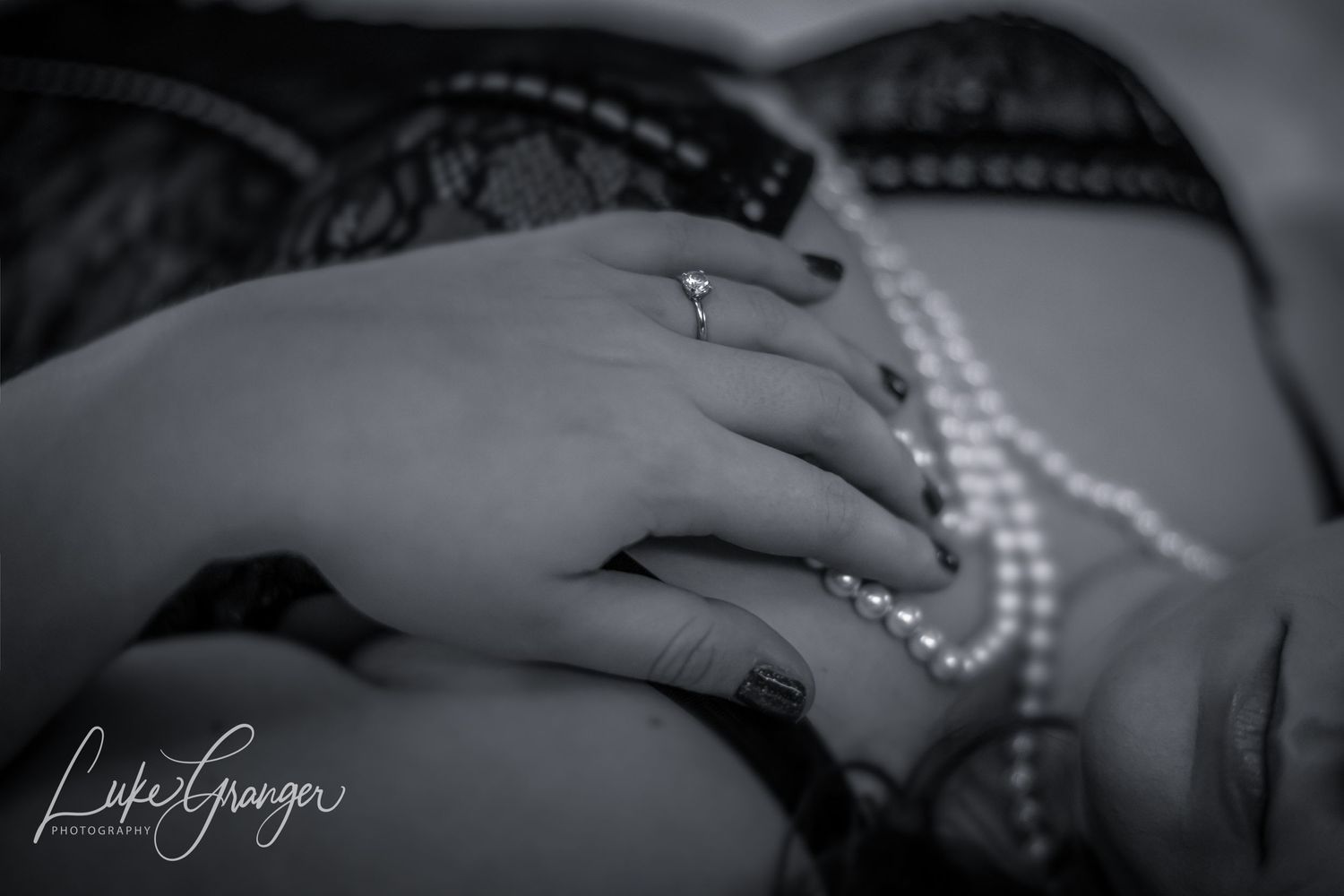 boudoir photo close up of hands and necklace