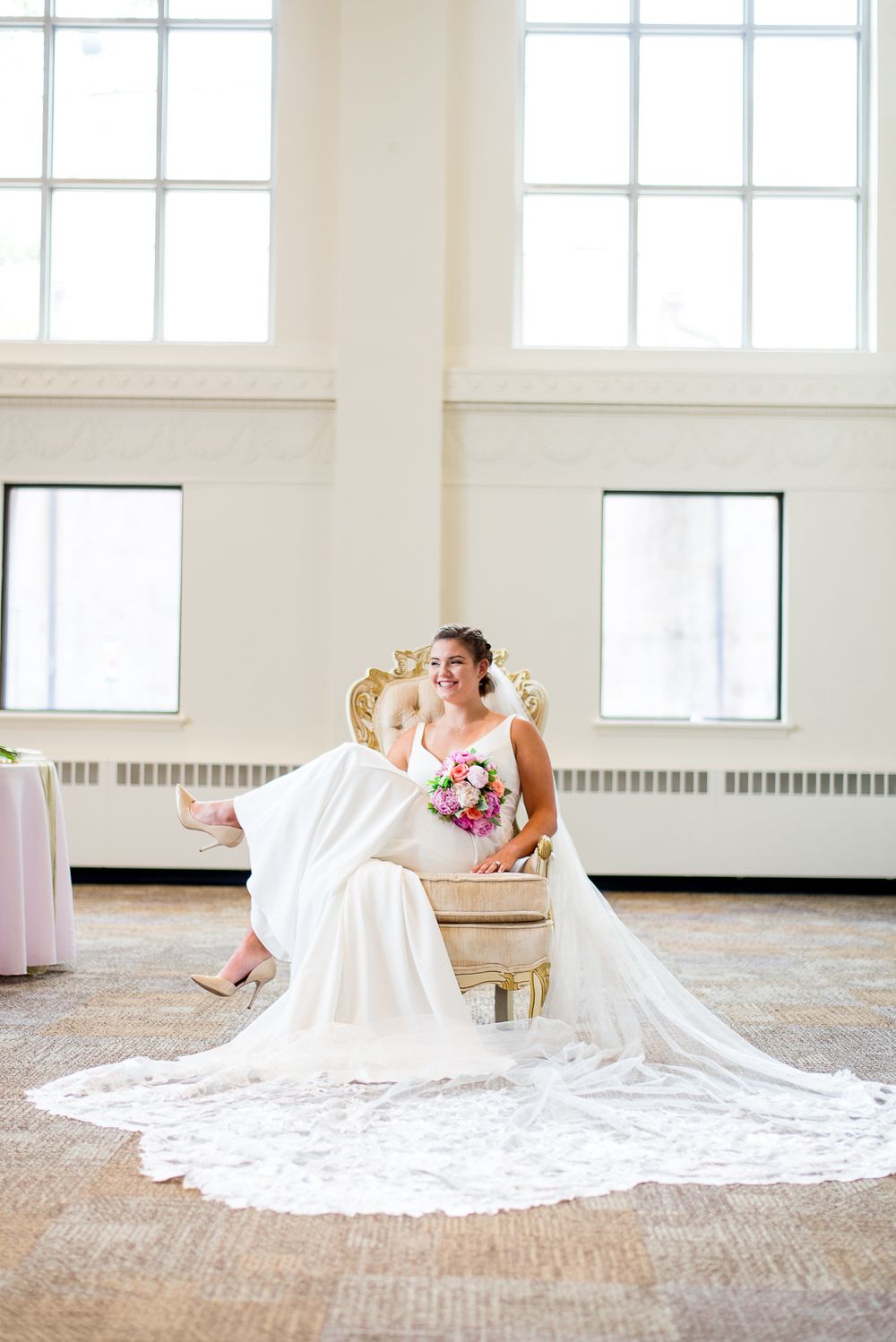 bride sitting, lace veil, Benison, colorful pastel bouquet in lap, smiling, Cincinnati OH