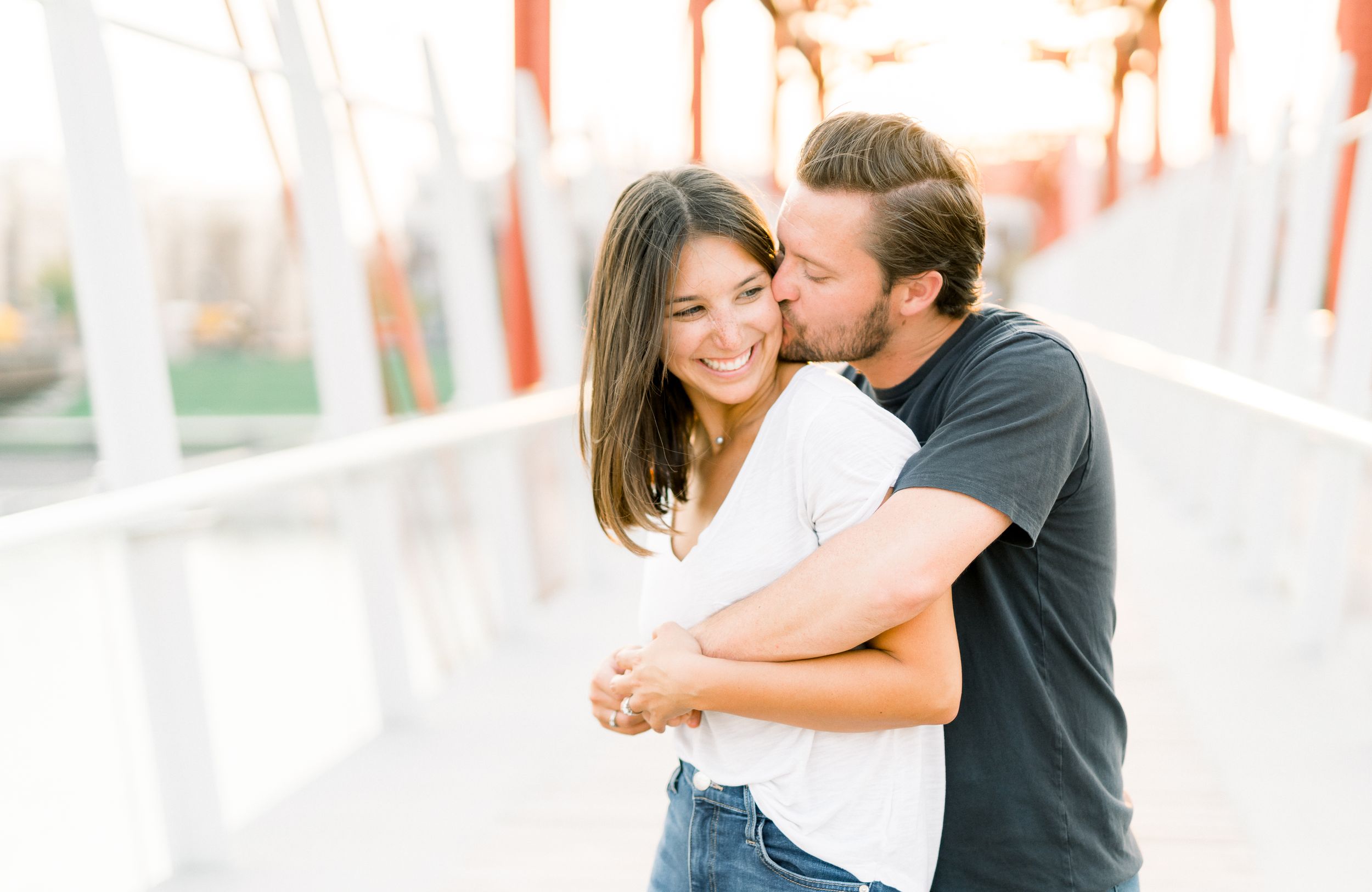 Des Moines Engagement photos in downtown Des Moines, Iowa with light and airy photographer Nicole Laing