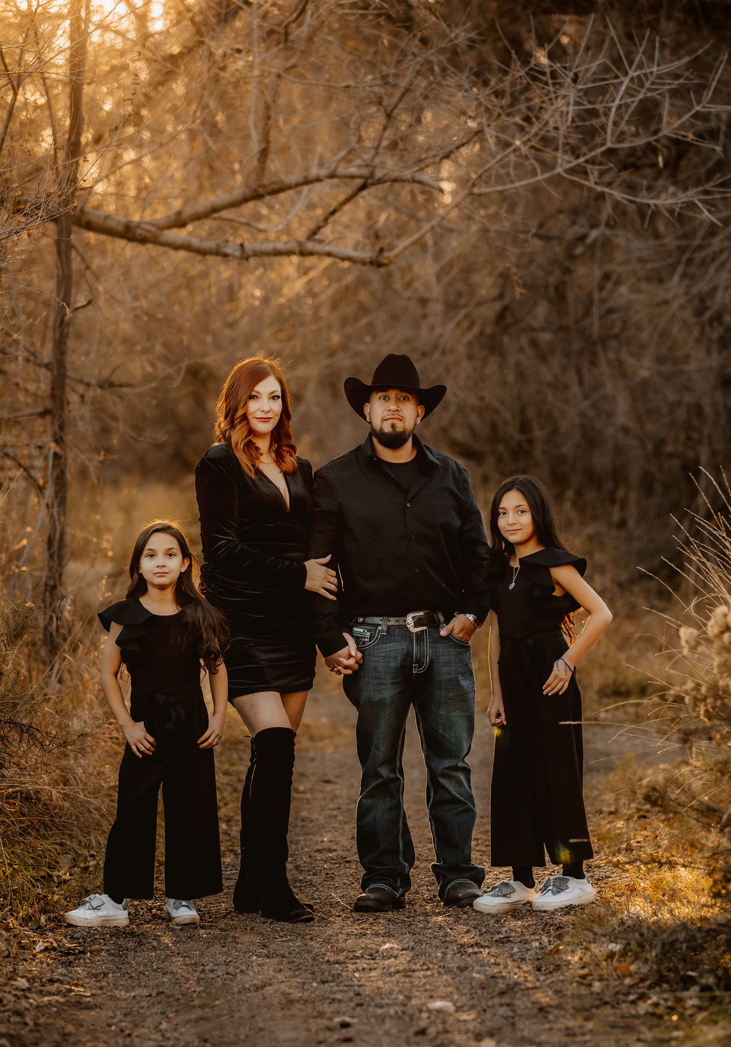 professional family photo session in rocky mountains in colorado. family of 4 posing in the mountains.liz rivas illuminating images